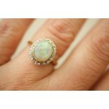 Opal and diamond cluster ring, cabochon opal approx.