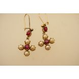 Pair of garnet and pearl cross form earrings, set in unmarked yellow metal,