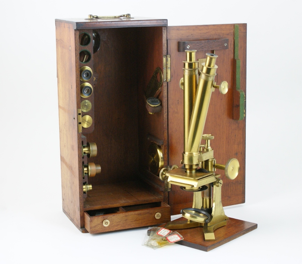 Lacquered brass binocular microscope by Solomons, Piccadilly, London,