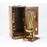 Lacquered brass binocular microscope by Solomons, Piccadilly, London,