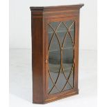 Late George III mahogany and inlaid hanging corner display cabinet, circa 1820,