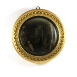 Regency gilt cavetto and ball convex wall mirror, circa 1810-20,