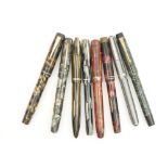 De La Rue 'Onoto' fountain pen, green semi-transparent case, 14k nib; also a De La Rue fountain pen,