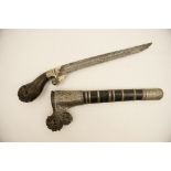 Northern Indian pesh kabz, having a carved and pierced wooden hilt,