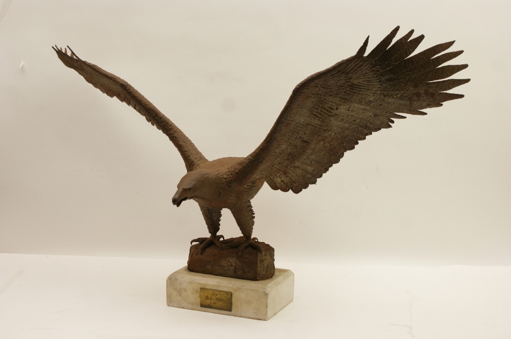 P Widmore, Golden Eagle with wings outstretched, metal sculpture, mounted on a white marble plinth,