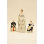 Victorian Staffordshire figure of Queen Victoria, circa 1840-60, modelled standing in ermine robes,