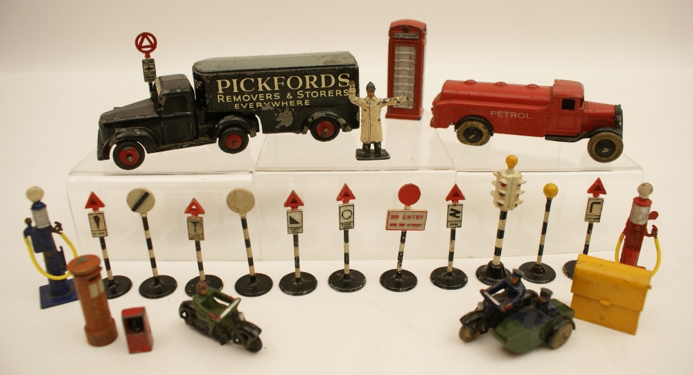 Timpo Toys Pickfords articulated removal lorry; also a Dinky petrol tanker; ten Dinky road signs;