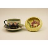 Moorcroft Anemone cup and saucer, light shade blue green ground,