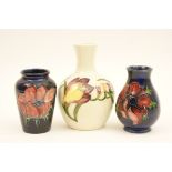 Moorcroft Freesia bottle vase, decorated with pink and yellow flowers against a white ground,