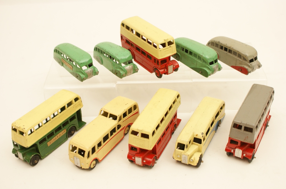 Four Dinky streamlined buses, open chassis type, one grey with red wheel covers,