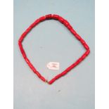 A red-stained coral large-bead necklace