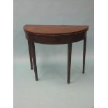 A George III mahogany card table, half-round shape with inlaid boxwood stringing, square tapering