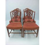 A set of six 19th century Hepplewhite-style mahogany dining chairs, camel-backs with interlaced