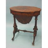 A Victorian inlaid burr walnut work table, oval-shape with hinged top enclosing fitted interior,