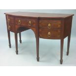 A Victorian Sheraton inlaid mahogany sideboard, cross-banded top above three oak-lined drawers and