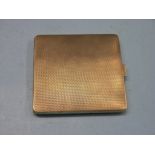 An engine-turned 9ct. gold cigarette case, Birmingham 1935, 104.4 grams