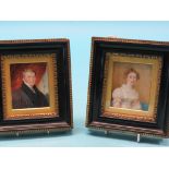 A pair of 19th century miniatures on ivory, half-length studies of a male and female, ebonised and
