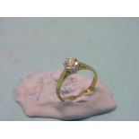 An 18ct. gold and diamond solitaire ring, claw-set stone approx. 0.65ct., size Q