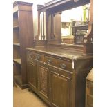 A late Victorian dark walnut sideboard, bevelled mirror back with over-shelf, panelled cupboard base