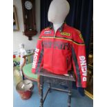 A motor cylcist's red leather Ferrari jacket