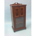 An Edwardian inlaid mahogany music cabinet, single, glazed door with two inlaid mahogany panels,