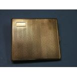 An engine-turned 9ct. gold cigarette case, Birmingham 1928, 111.8 grams; personalised inscription