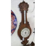A carved oak wheel barometer, with thermometer dial, 36in.
