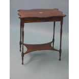 An Edwardian inlaid rosewood occasional table, serpentine-shaped top on slim turned legs with