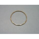 A 9ct. gold bangle, angled design, 24 grams