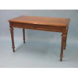 A good quality Victorian walnut writing table, rectangular polished top above two oak-lined frieze