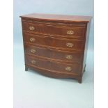 A reproduction mahogany chest, bow-fronted, brushing slide above four long drawers, oval, pressed