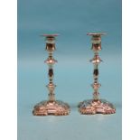 A pair of George II-style silver candlesticks, with detachable sconces, knopped stems, square bases,