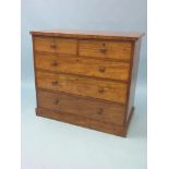 A Victorian mahogany chest, two short and three long mahogany-lined drawers, each with turned wood