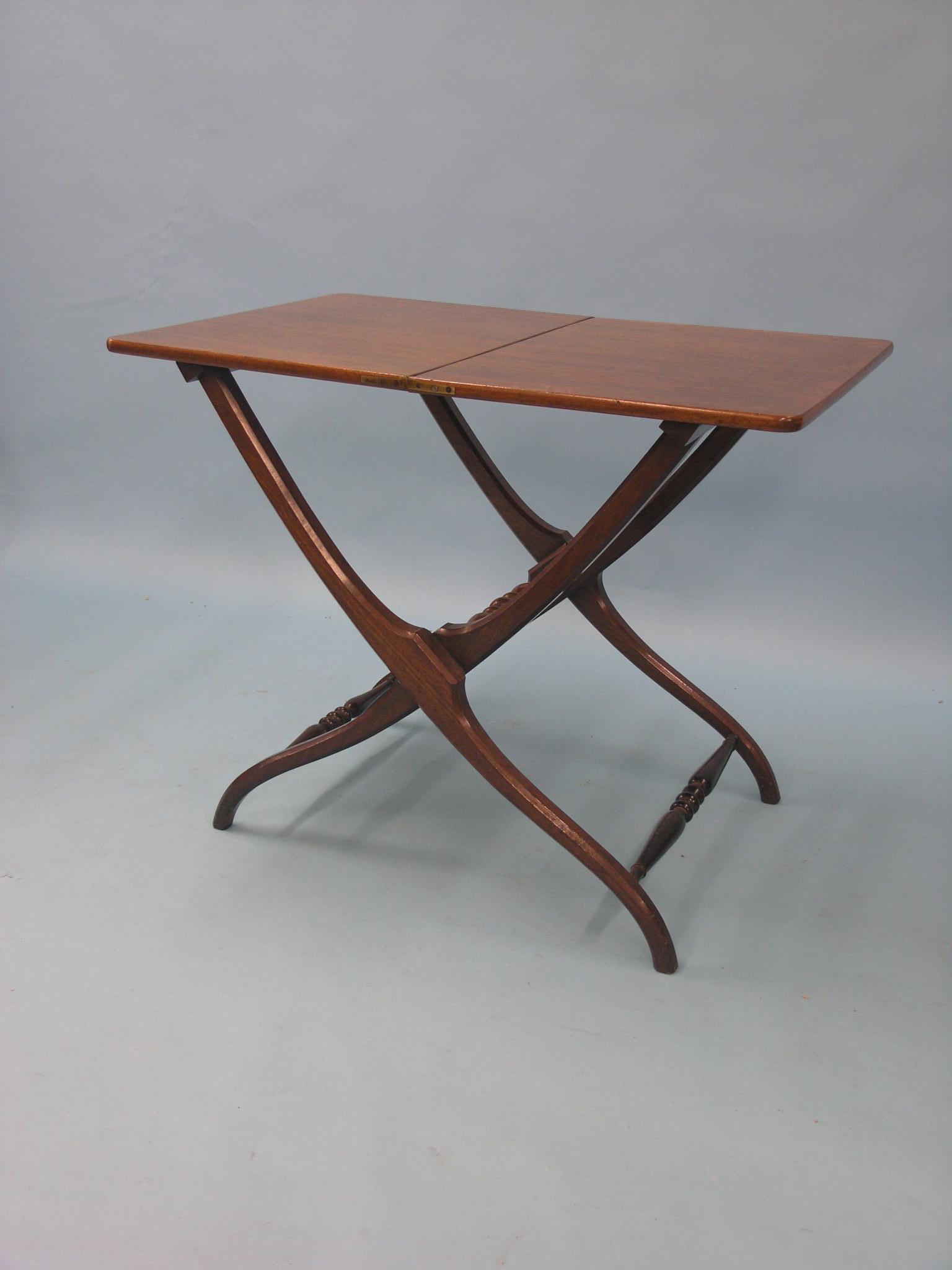 A Victorian mahogany patent-action folding table, turned underframe with Horne Patent locking