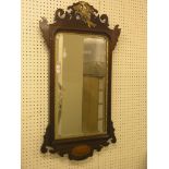 A Chippendale-style mahogany wall mirror, pierced cresting carved with gilded bird, inlaid shell