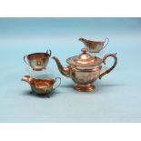 A silver teapot, Birmingham 1932, two silver sauce jugs and a silver sugar bowl, approx. 26oz.