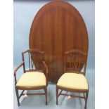 A good quality reproduction mahogany dining set, large table with oval cross-banded top, 6ft. x 4ft.