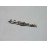 An Art Deco white metal bar brooch, set clear and blue stones