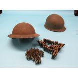 Two WWII metal helmets, German and Police, various rounds of amunition, replica rifle and pistol,