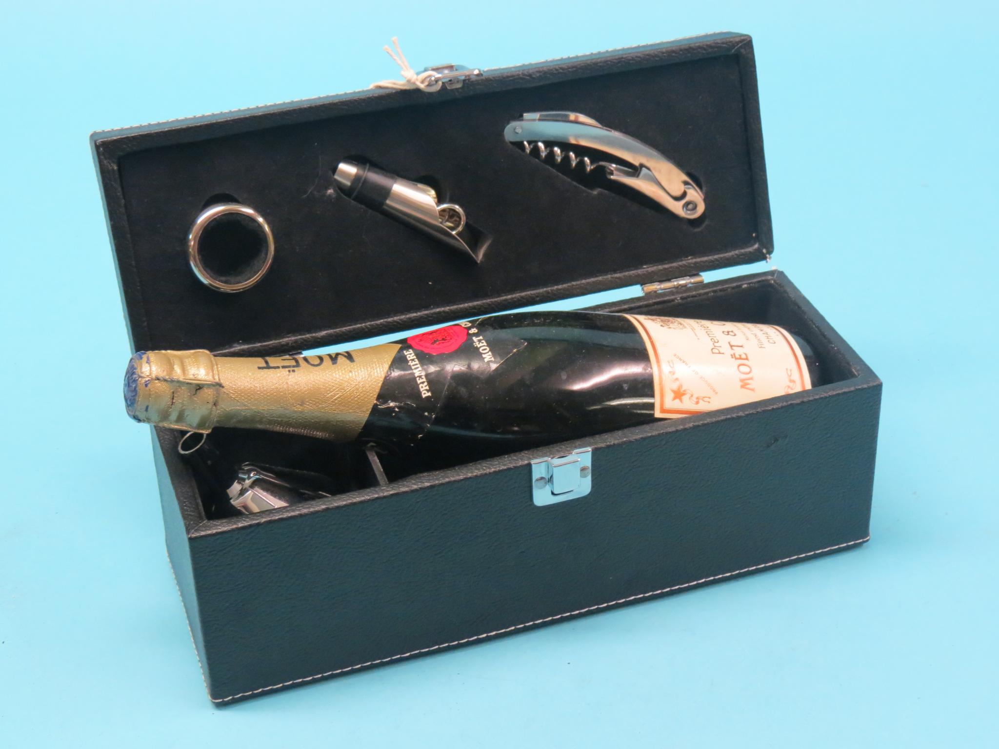 Moet & Chandon Champagne, Premiere Cuvee, 75cl., no date, together with a wine accessory kit