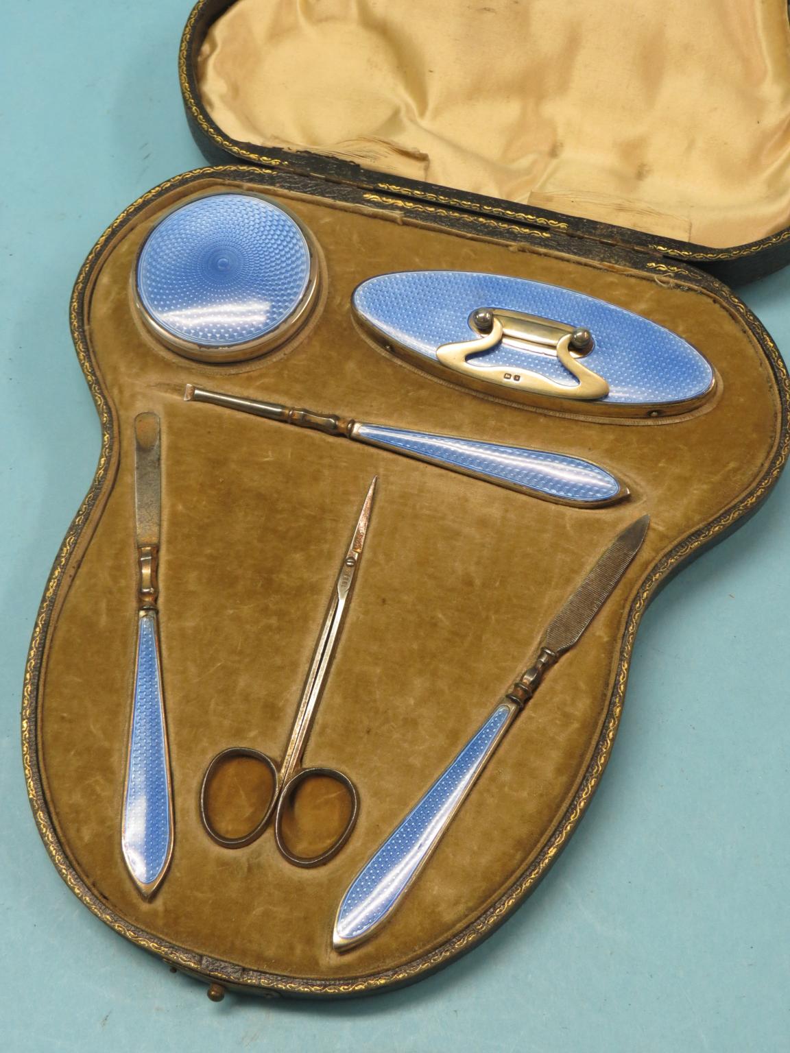 A silver and translucent-enamel vanity set, six pieces contained within original fitted case,
