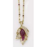A carved ruby and diamond necklace montatura in oro giallo 750/1000 Starting Price: €3000