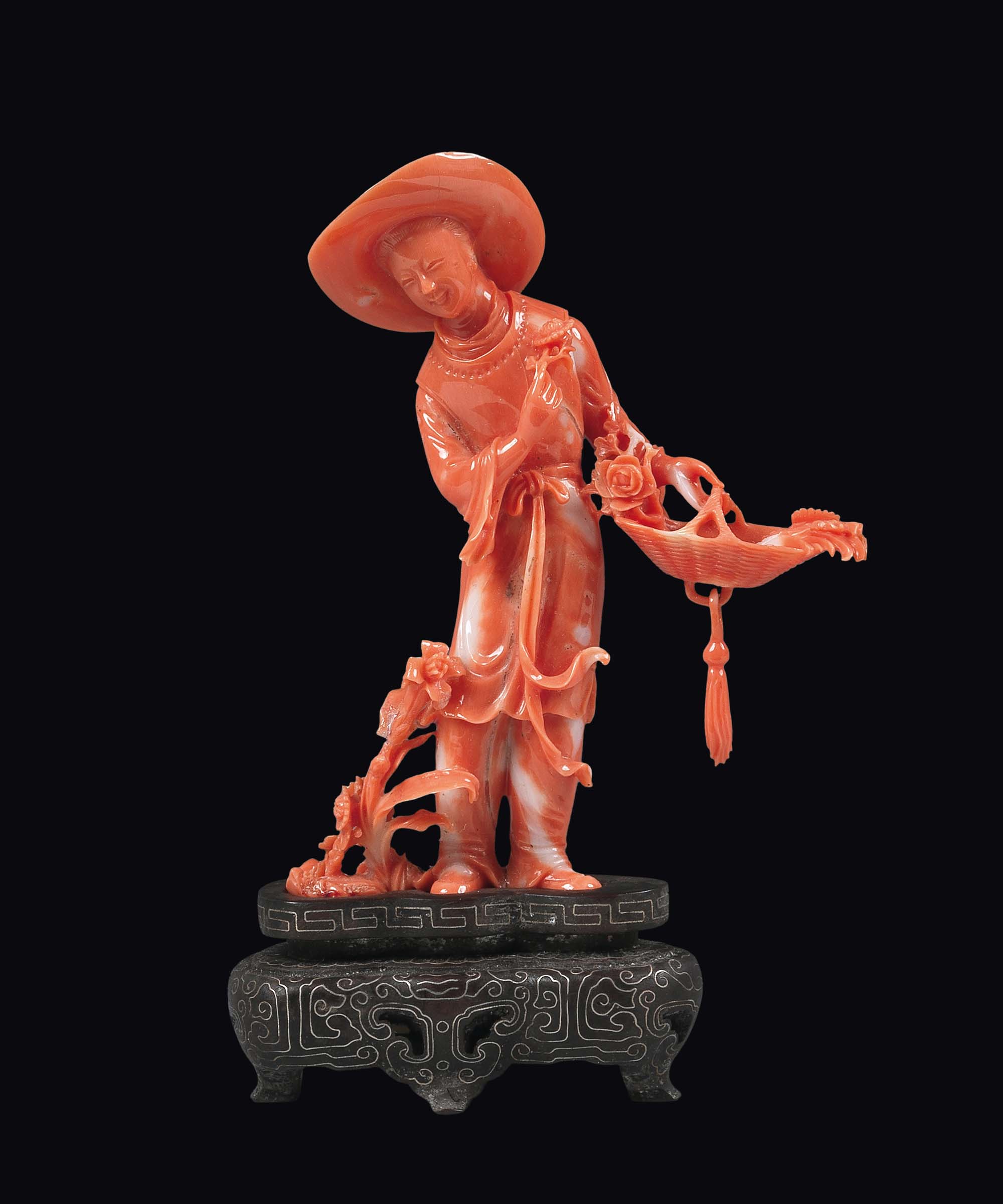 A carved coral figure of farmer with a hat and a wicker basket, China, early 20th century gr. 63,