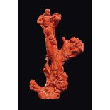 A large carved coral group "Guanyin on flowers with a grapes in her hand surrounded by birds and