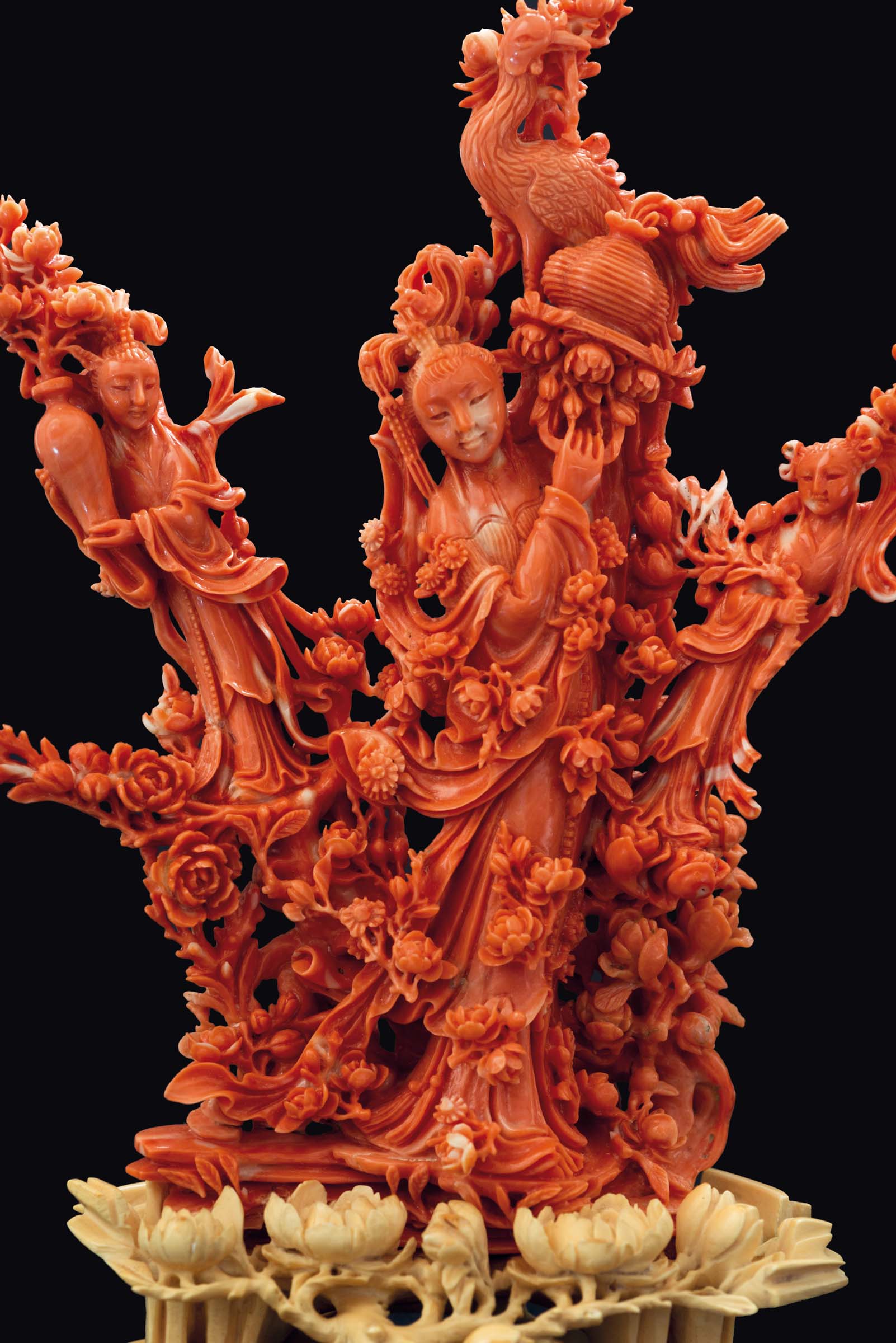 A finely carved coral group of three Guanyin between roses with carved ivory base, China, early 20th - Image 2 of 3