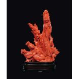 A carved coral "two Guanyin with fan and flowering branches" group, China, early 20th century gr.