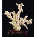 A large carved white coral "seven Guanyin with vases and birds" group, China, early 20th century gr.