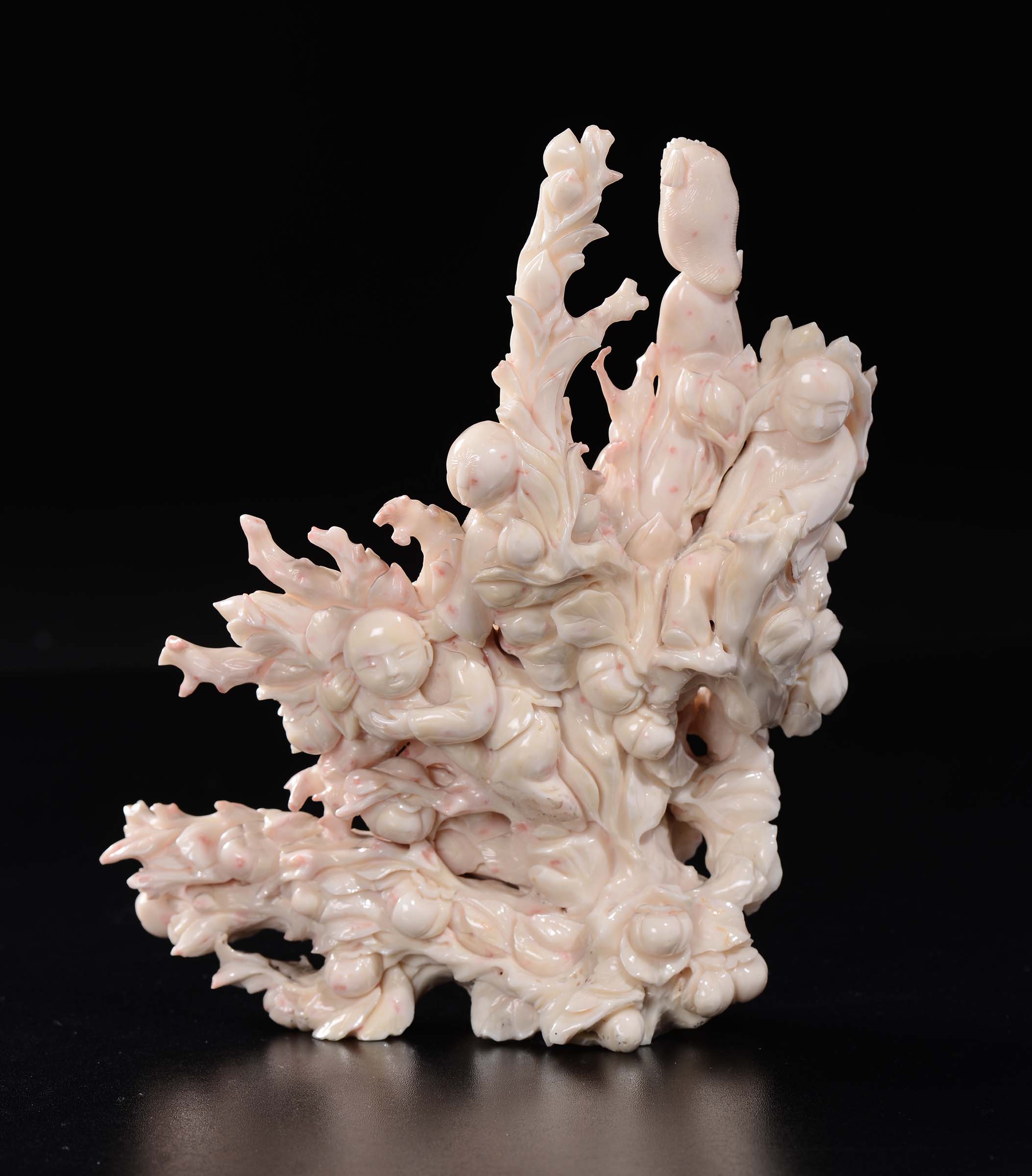 A carved white coral "Guanyin and children between branches and peaches" group, China, early 20th - Image 2 of 2