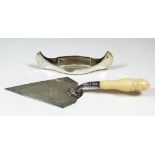 A Victorian silver and ivory handled presentation trowel, the blade engraved with band of leaf