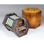 A late 19th Century rosewood concertina by Lachenal & Co of London with forty-eight key and four